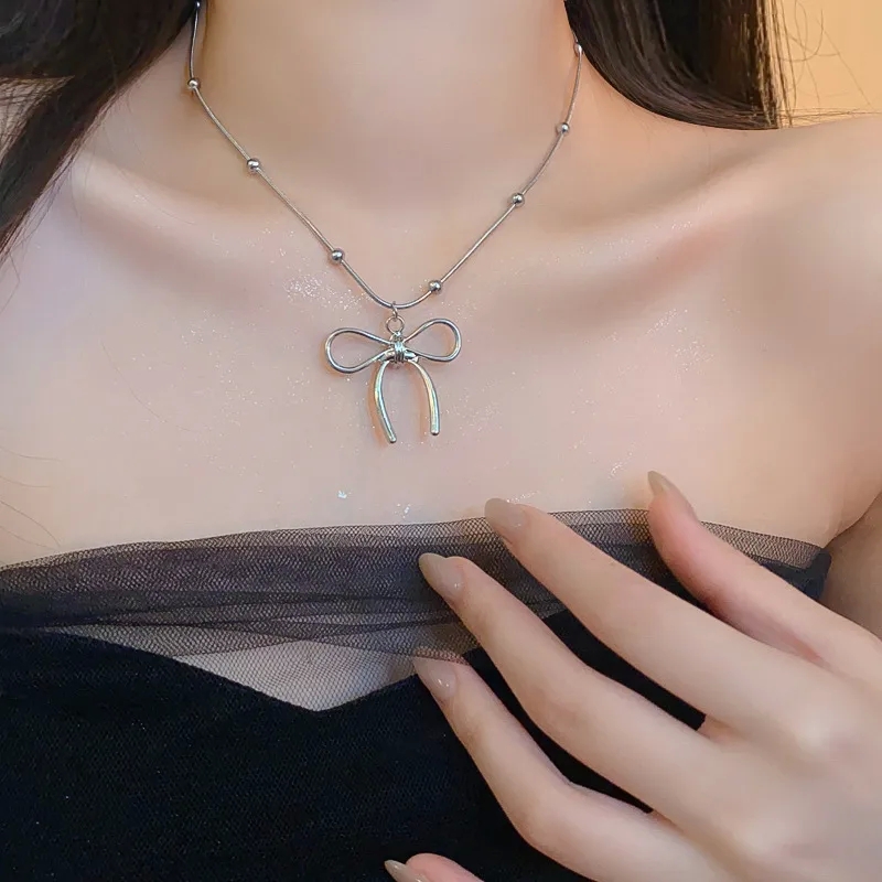 fine jewelry fidget ring Ethically fine jewelry manufacturer Made Vintage-Inspired Titanium Bow Knot Necklace with Personalized Customization Options svs fine jewelry