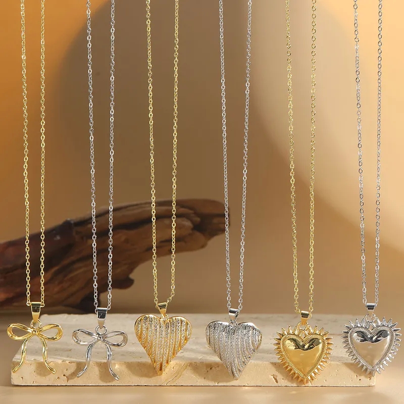 Sustainable 14K Gold Inlay Heart Bow Necklace - Shiny Zircon Pendant for High-Fashion Festival Style