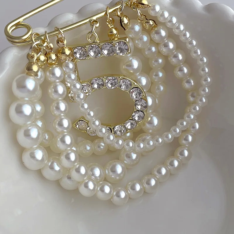 fashion accessories retail "Wholesale Sleek Rhinestone Brooches: Vibrant Alloy & Pearl Inlay for fashion accessories region Fashion-Forward Affordable Luxe Style" region 1 fashion accessories